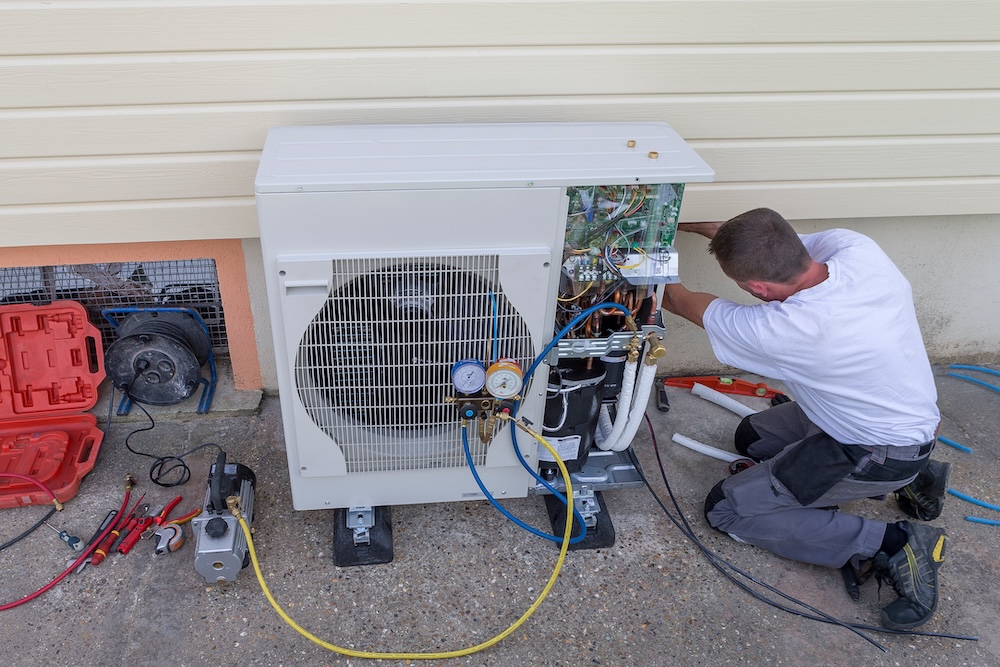 Professional heat pump installation in progress at a home in Surrey, BC, ensuring energy-efficient heating and cooling