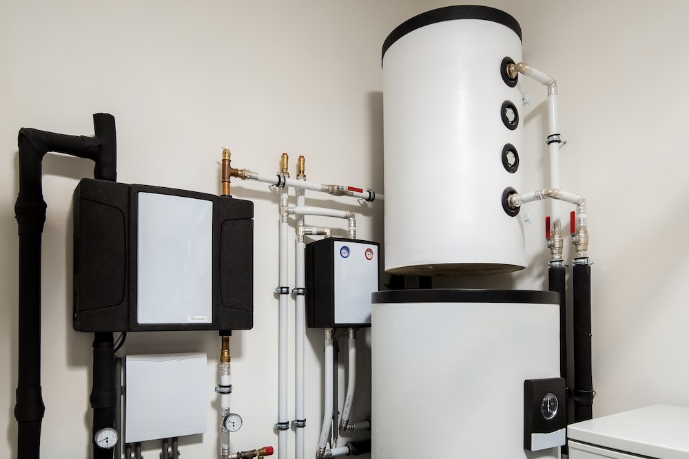 Modern heat pump system with a boiler and water tank setup for residential heating in Surrey, BC